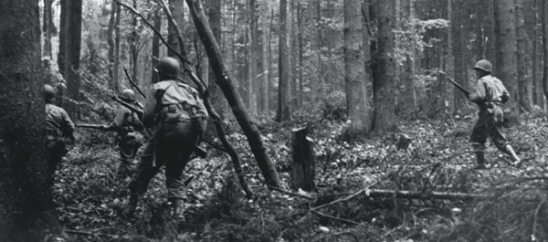 28th Infantry Division troops advance through the HÃ¼rtgen Forest  in Germany on November 2, 1944, at the start of a long, bloody fight. (PFC G. W. Goodman/U.S. Army/National Archives)