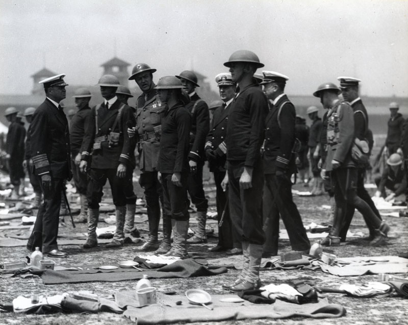 Naval and Marine officers meet on a Shanghai racecourse to inspect a U.S Asiatic force drill. (National Archives)