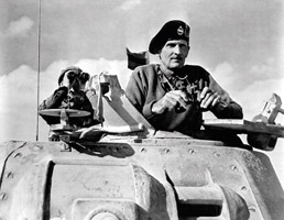 Bernard “Monty” Montgomery looks over the 1942 El Alamein battlefield. (Office Of War Information/National Archives)
