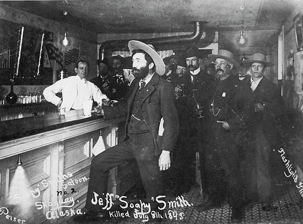 Con man extraordinaire Soapy Smith finds refreshment—and plenty of elbow room—at Jeff's Parlor, his own Skagway, Alaska, saloon. (Library of Congress)