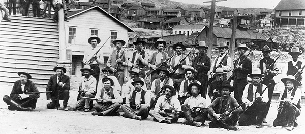 The Arizona Rangers assembled in Morenci in 1903 to control labor unrest at the local mines. Captain Tom Rynning sits cross-legged at far left. W.W. Webb is the leftmost seated man in the front row. Frank Wheeler is in the second row, fourth from right. (Arizona Historical Society, Tucson)