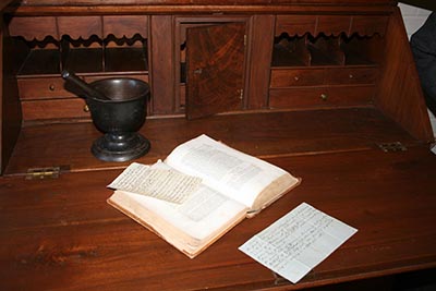 A mortar and pestle and book of remedies are among the surviving artifacts from the life of Elder John Kline, an influential Brethren minister and herbalist in Rockingham County, Va. A staunch opponent of the Civil War, Kline was murdered by Confederate militiamen in 1864. (Patty Kelly)