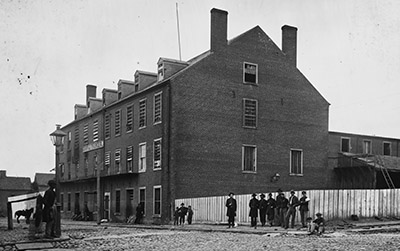 Commandeered tobacco warehouses made up Richmond's notorious Castle Thunder Prison, a dumping ground for political prisoners early in the war. But the jailed religious dissenters had their supporters. "They are good and harmless citizens in times of peace," wrote the editor of the Staunton Spectator in 1862, "and we cannot believe them to be traitors in times of war." (Library of Congress)