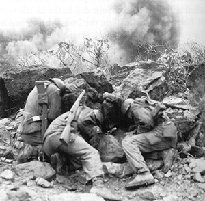 A U.S. combat team shields itself from Chinese mortar fire. (National Archives)