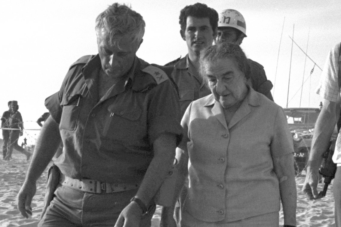 Israeli prime minister Golda Meir and Ariel Sharon, commander of the 143rd Reserve Armored Division, visit the southern command in the Sinai. (Israeli Government Press Office)