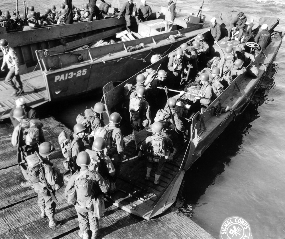 Soldiers of the 4th Infantry Division board LCVPs (landing craft, vehicle, personnel) attached to the U.S. Navy attack transport Joseph T. Dickman (APA-13) in Portsmouth, England, prior to steaming across the English Channel to the Normandy coast on the night of June 5, 1944. (National Archives)
