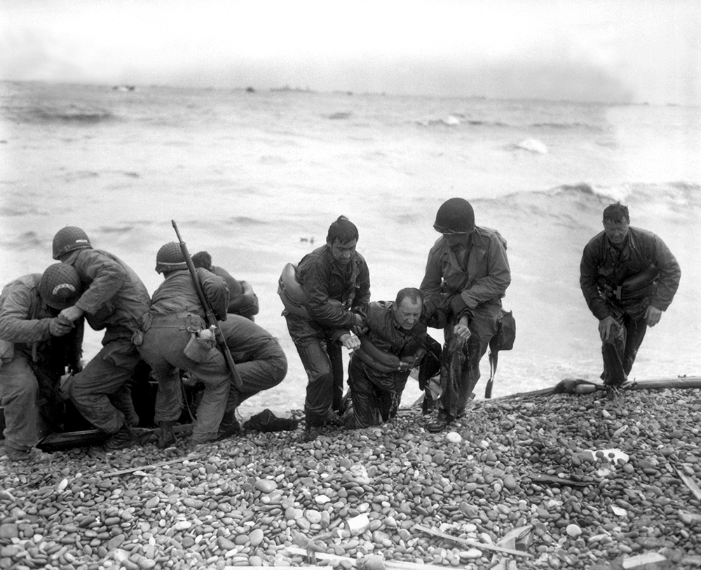 Soldiers of the 4th Infantry Division come ashore on Utah Beach. The first—and, at age 56, the oldest—general to land in Normandy, 4th Division deputy commander Brig. Gen. Theodore Roosevelt Jr., quickly learned that he was in the wrong place, but after personally reconnoitering the area, calmly declared, “We’ll start the war from here,” and coordinated the advance, greeting and directing each successive wave. Roosevelt was subsequently awarded the Medal of Honor. (National Archives)