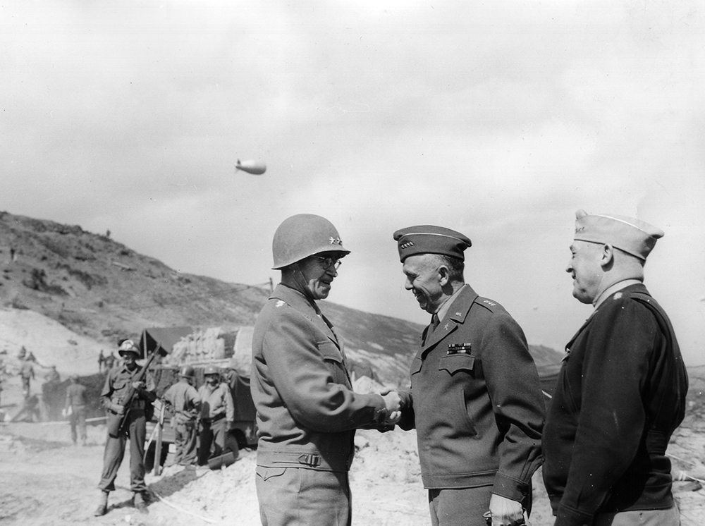 Gen. George C. Marshall, U.S. Army Chief of Staff (center) confers with Lt. Gen. Omar N. Bradley, commander of the First Army, at Omaha Beach on June 14. Bradley was subordinate to Field Marshal Bernard L. Montgomery’s 21st Army Group until after the Allied breakout from the Cotentin Peninsula in August 1944, when he was promoted to command the American 12th Army Group comprised of the First Army, under Maj. Gen. Courtney H. Hodges, and the newly arrived Third Army under Lt. Gen. George S. Patton Jr. (National Archives)