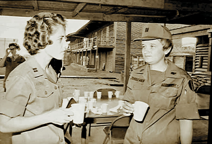 Jurgevich (right) talks with a fellow WAC captain at Long Binh Post near Saigon. (Courtesy of The Army Women’s Foundation)