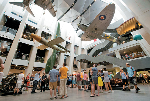 A Hawker Siddeley Harrier, a German V-1 flying bomb and a Supermarine Spitfire soar over IWM London's dramatic new atrium. (Andrew Tunnard: Imperial War Museums)